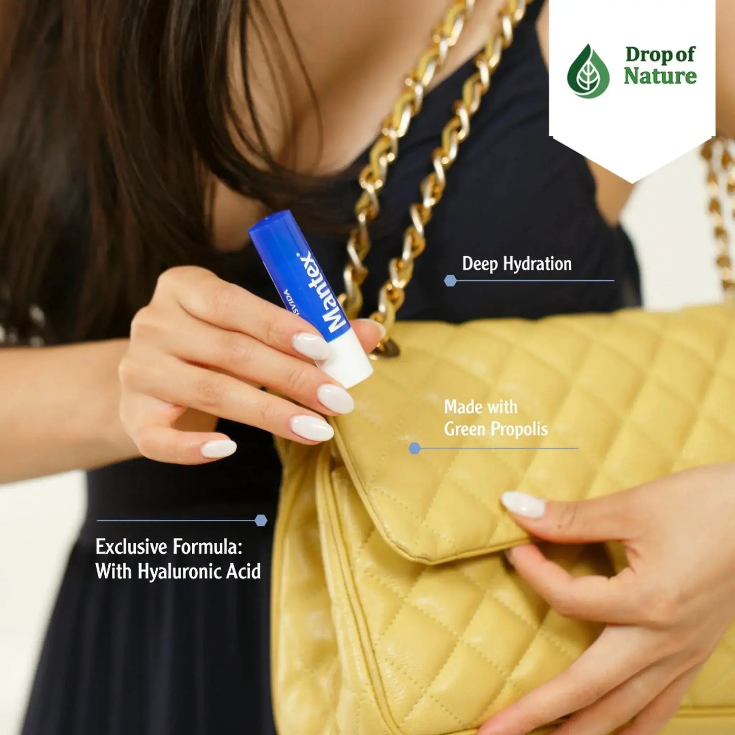 A person holds a yellow handbag while using a blue Manitex lip balm, emphasizing deep hydration and natural ingredients.