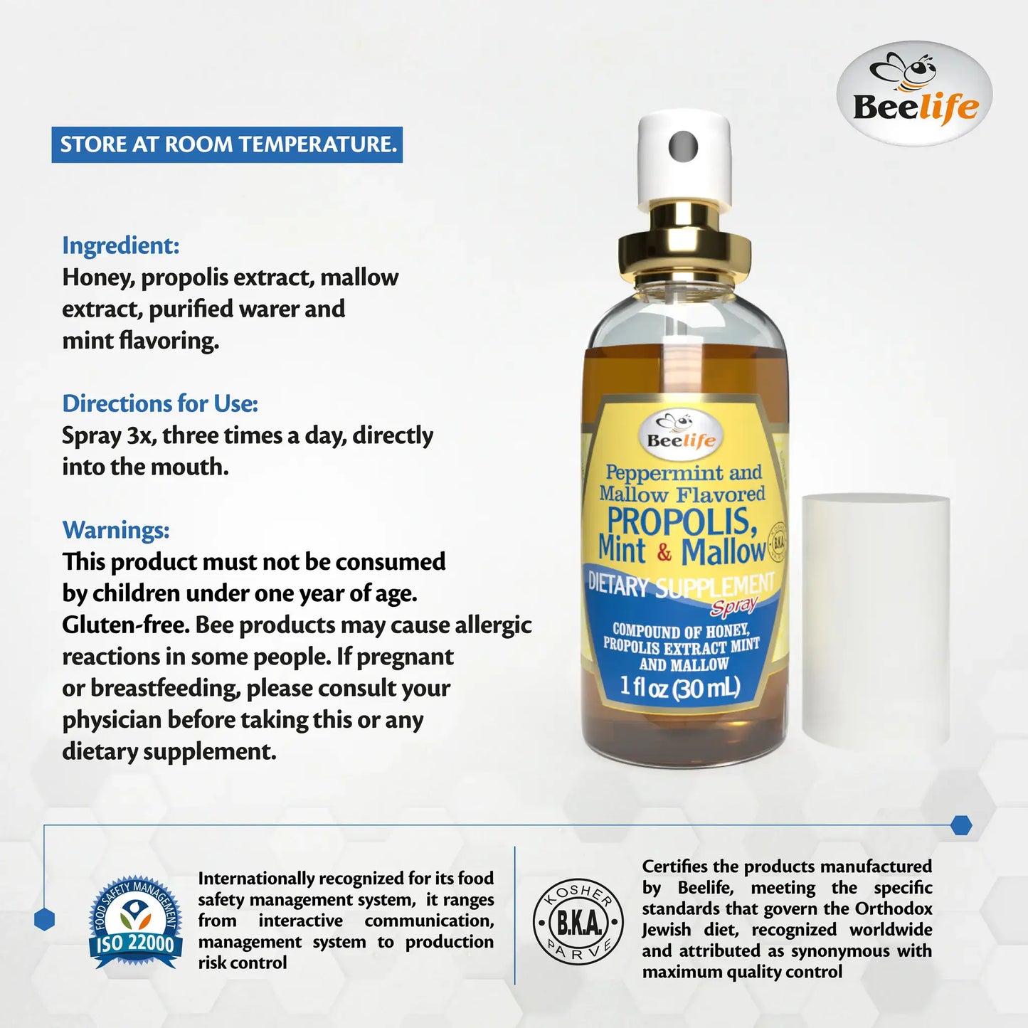 Alt text: Clear glass spray bottle with a label featuring a honeycomb design, mint and mallow flavor, and health warnings.