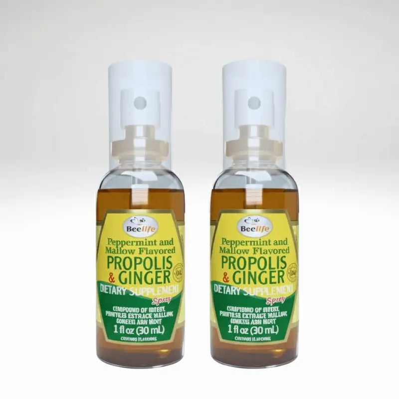 Two bottles of BeeLife Propolis & Ginger dietary supplement on a white background