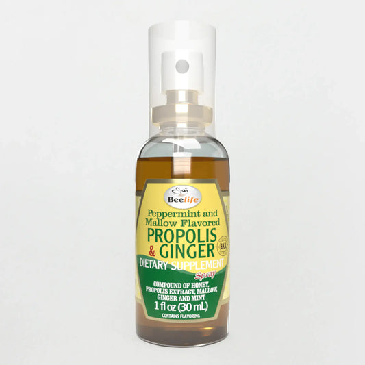 Clear spray bottle of BeeLife Honey & Ginger Propolis Throat Spray with a green and yellow label, featuring flavor details.