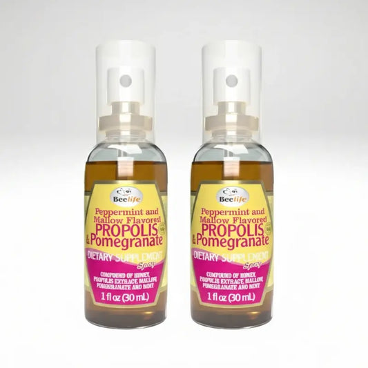 Two bottles of BeeLife Propolis & Pomegranate spray on a white background