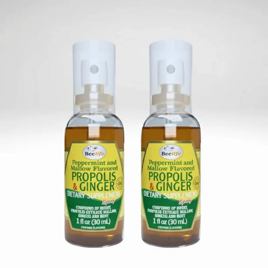 Two bottles of BeeLife Propolis & Ginger dietary supplement on a white background