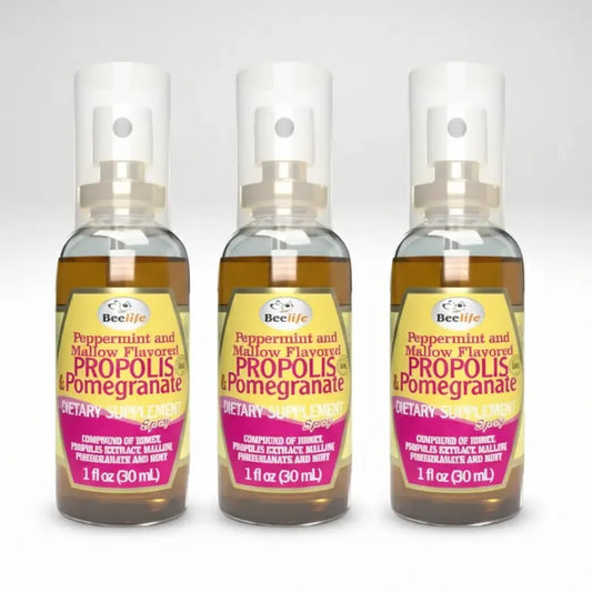 Three bottles of BeeLife Propolis & Pomegranate dietary supplement on a white background