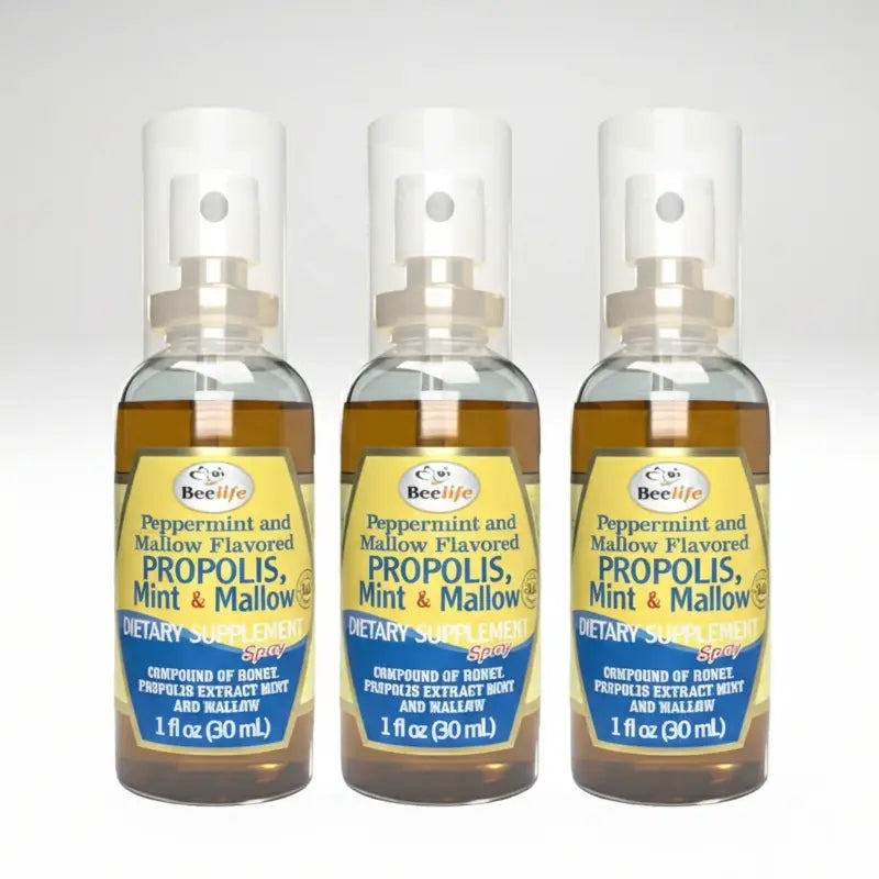Three bottles of BeeLife peppermint and mallow flavored propolis, mint, and mallow dietary supplement on a white background.